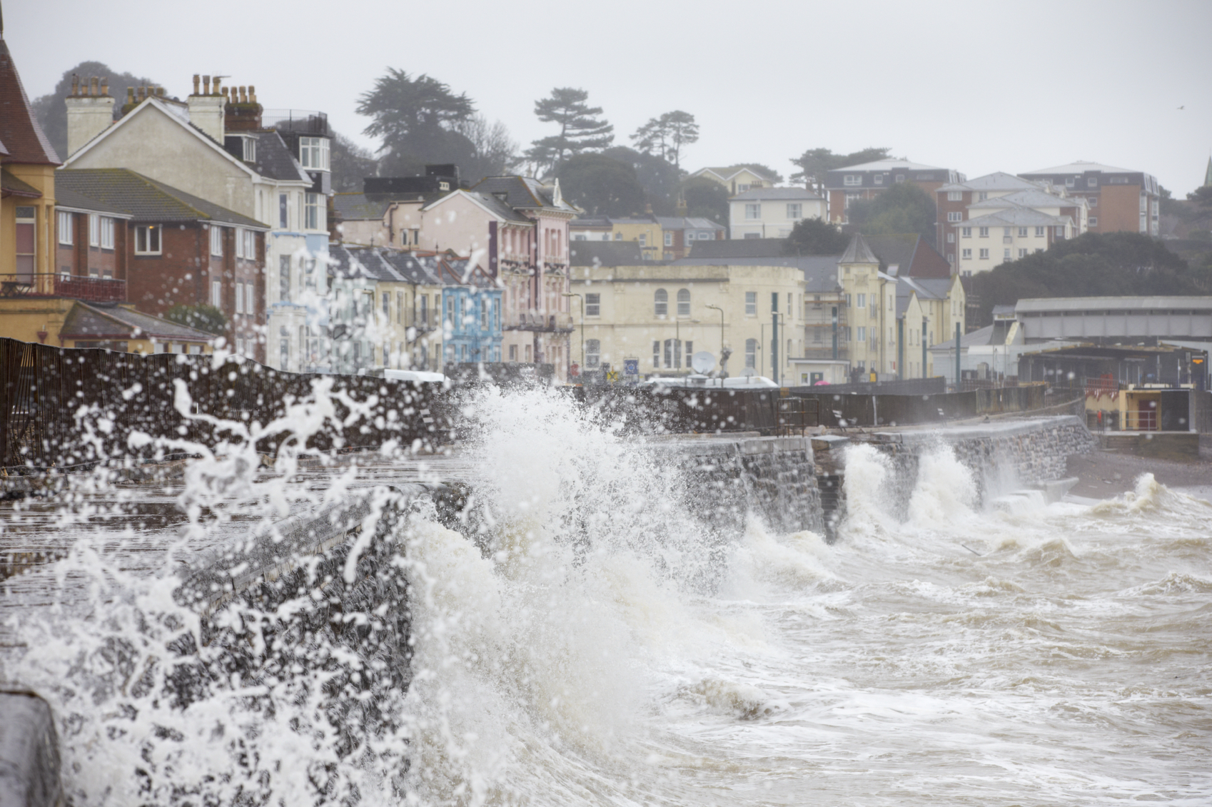 Large Waves Breaking Against Sea Wall At Dawlish In Devon